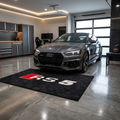 Audi RS5 garage floor mat, 5x7 ft (60x87"), bold red and white RS5 logo on black background with dimensions shown.
