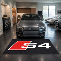 Audi S4 garage floor mat, 5x7 ft (60x87"), bold red and white S4 logo on black background with dimensions shown.