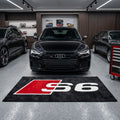 Audi S6 garage floor mat, 5x7 ft (60x87"), bold red and white S6 logo on black background with dimensions shown.
