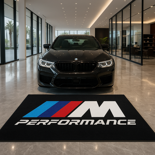 Large BMW M Power logo floor rug with iconic tricolor stripes, 5x7 feet, non-slip backing, displayed in a high-tech garage.
