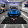 Corvette C7 garage floor mat, 5x7 ft (60x75"), C7 crossed flags emblem and CORVETTE wordmark in red silver and gold on black background with dimensions shown.