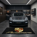 Porsche Panamera garage floor mat, 5x7 ft (60x87"), full Porsche crest shield and gold Panamera script on black background with dimensions shown.
